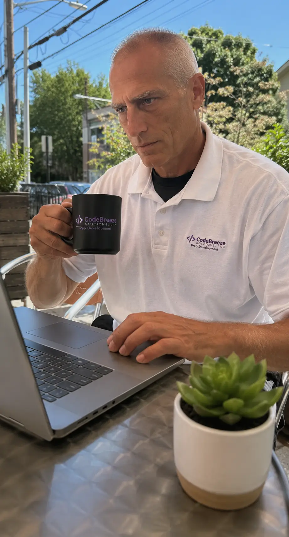 Kevin Mohan working on a laptop